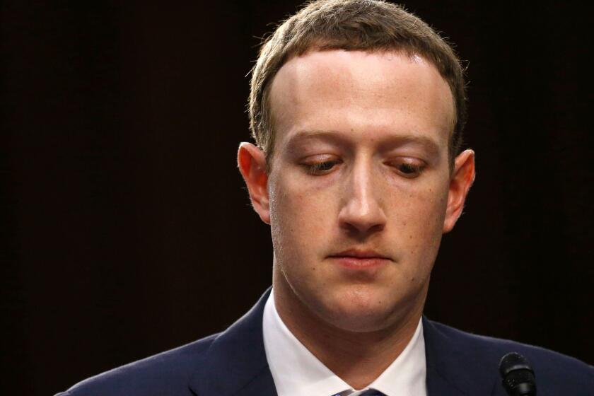 A photograph featured in Frontline's "The Facebook Dilema." Facebook CEO Mark Zuckerberg listens while testifying before a joint Senate Judiciary and Commerce Committees hearing regarding the company?s use and protection of user data, on Capitol Hill in Washington, U.S., April 10, 2018. REUTERS/Leah Millis - HP1EE4A1SCS7O