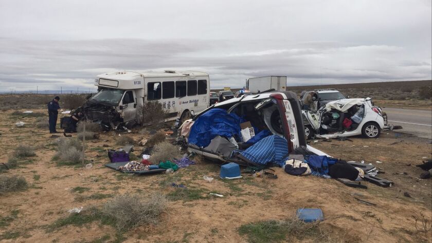 A charter bus traveling from Fresno to Las Vegas crashed into two vehicles in the Mojave Desert. One person was killed and 26 were injured in the accident, authorities said.