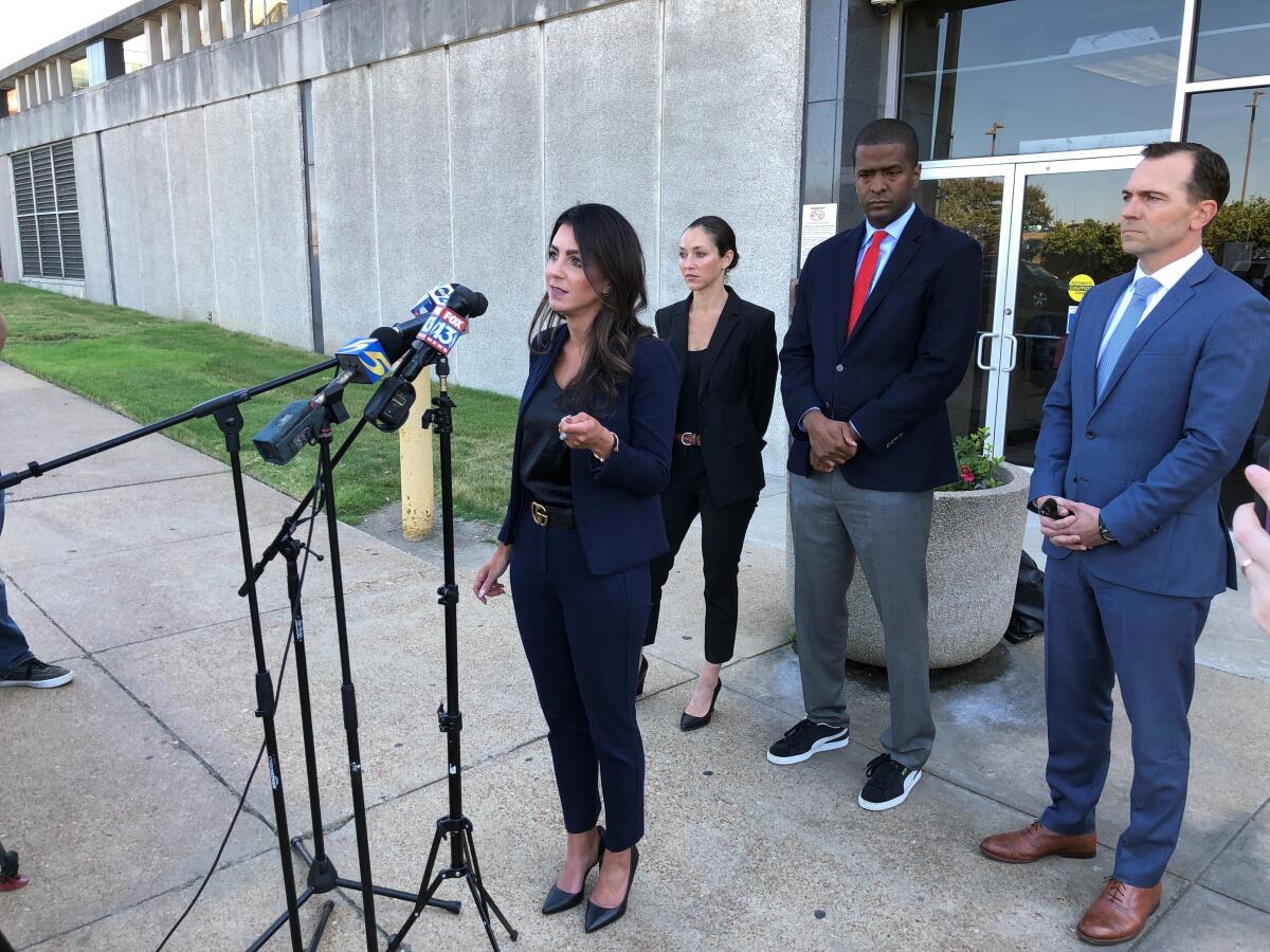 FILE - Attorney Alexandra Benevento, center, speaks with reporters during a news conference announcing a cheerleader abuse lawsuit filed in Tennessee on Tuesday, Sept. 27, 2022, in Memphis, Tenn. The American cheerleading company behind the sport’s top uniforms, camps and competitions is evaluating a possible defamation case against lawyers who have named the enterprise in a series of federal lawsuits alleging sexual abuse at gyms across the Southeast. In a letter sent Tuesday, Nov. 1, defamation attorney Thomas Clare accused civil rights attorney Bakari Sellers and lawyers with the Strom Law Firm of making false and defamatory statements about Varsity Spirit’s relationship to the alleged sexual abuse of cheerleaders by coaches at gyms in South Carolina, Tennessee and North Carolina.(AP Photo/Adrian Sainz, File)