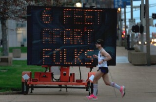 A jogger in St. Louis on Thursday.