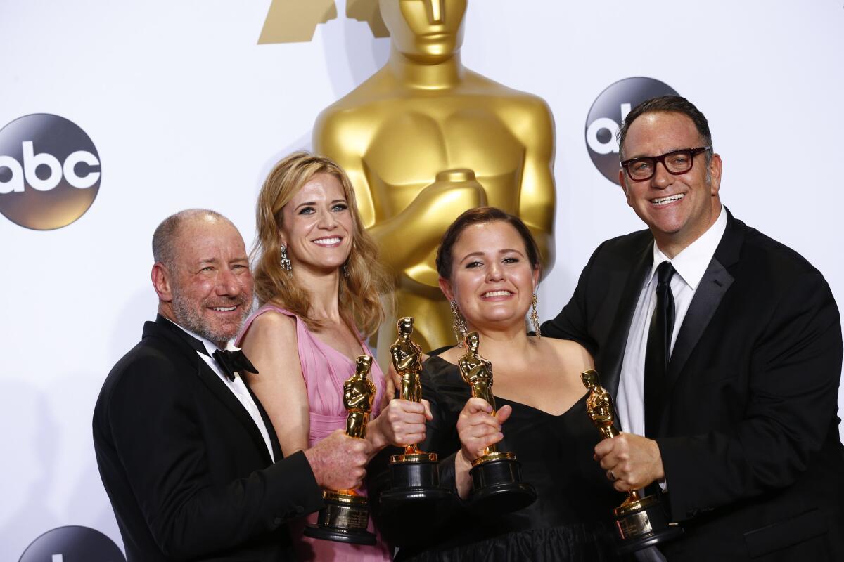 The producers of best picture winner "Spotlight," from left: Steve Golin, Blye Pagon Faust, Nicole Rocklin and Michael Sugar.