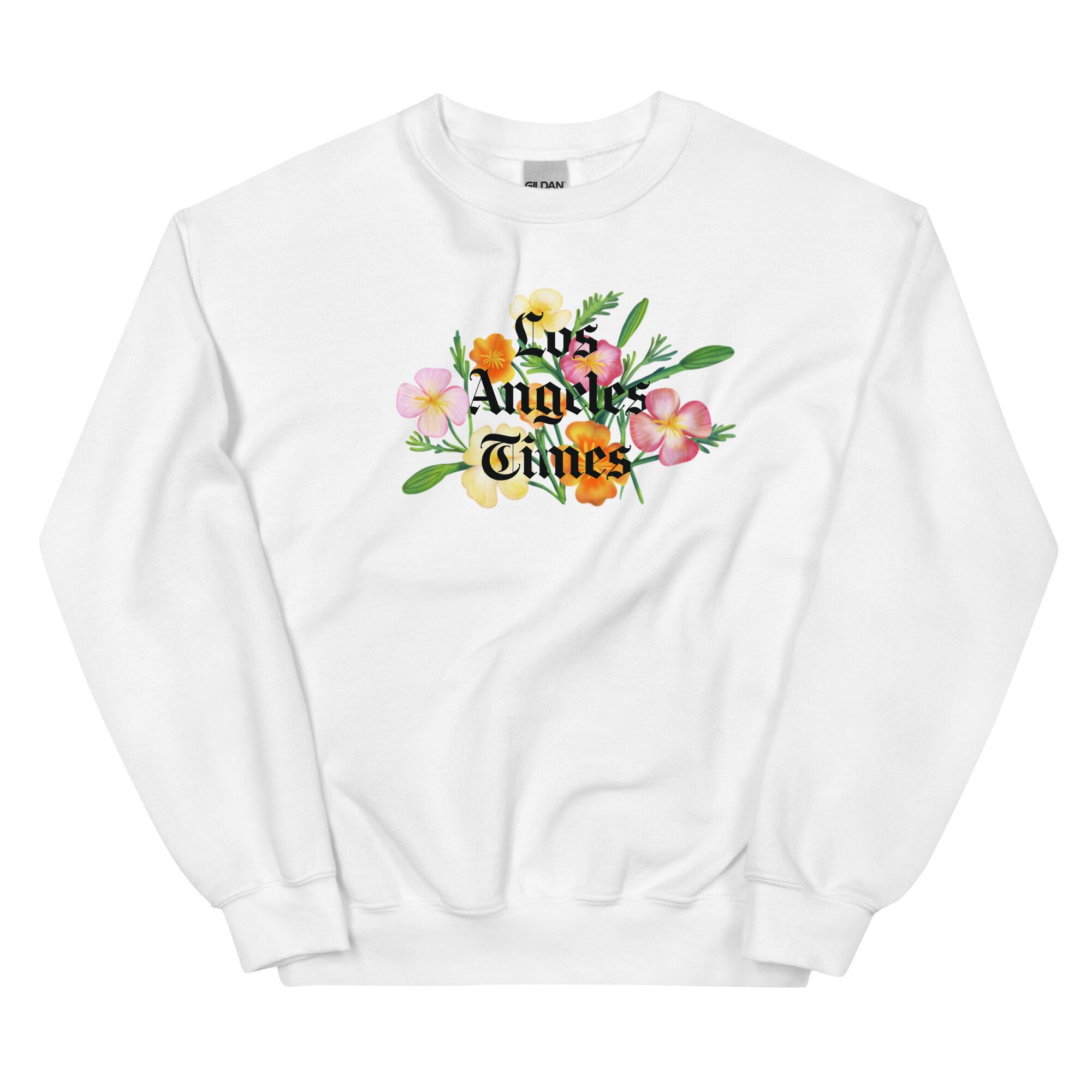 A white sweatshirt with the Los Angeles Times logo on poppies. 