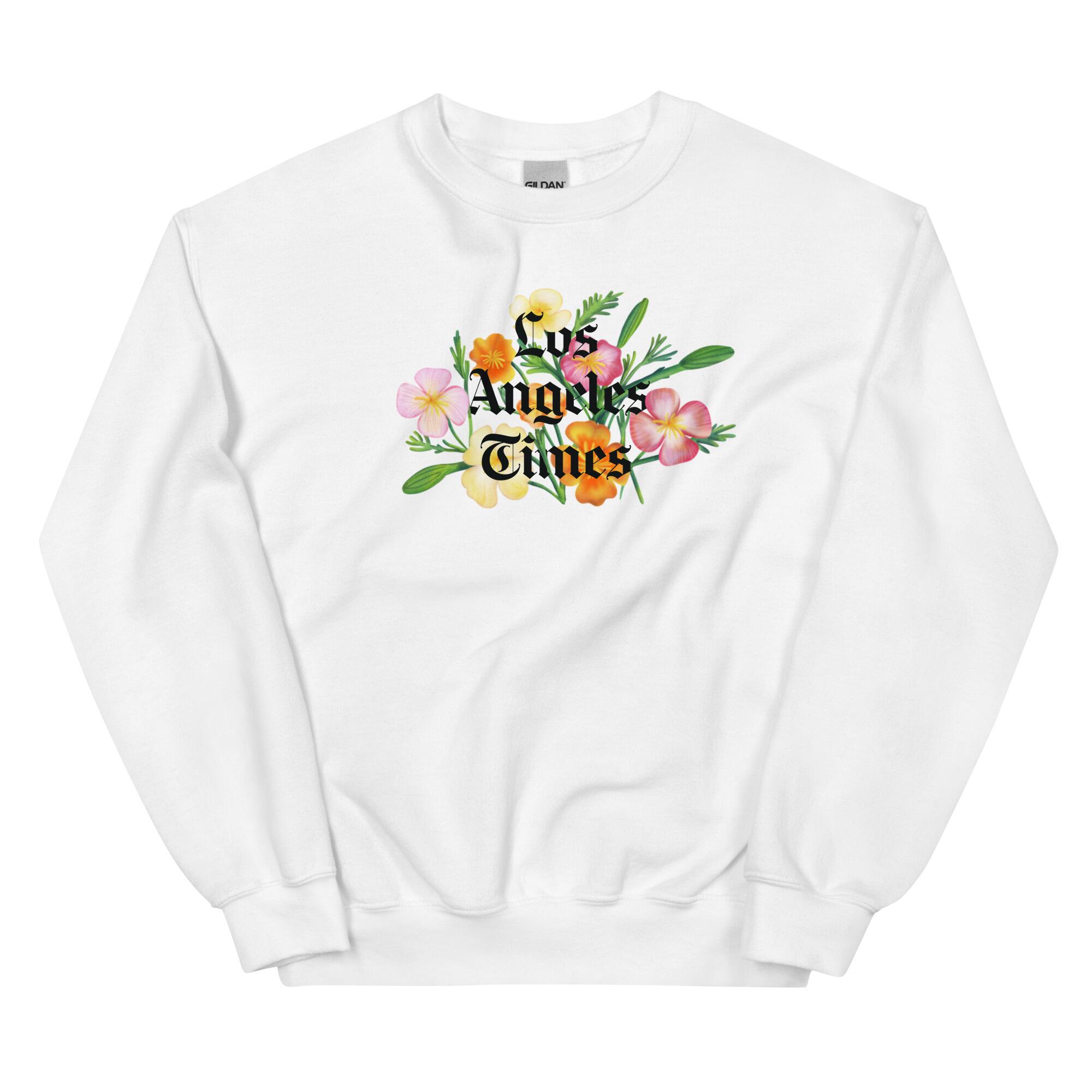 A white sweatshirt with the Los Angeles Times logo on poppies.