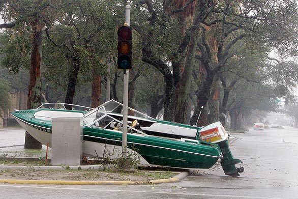 A boat lies in a street after Hurricane Ike battered Galveston, Texas.