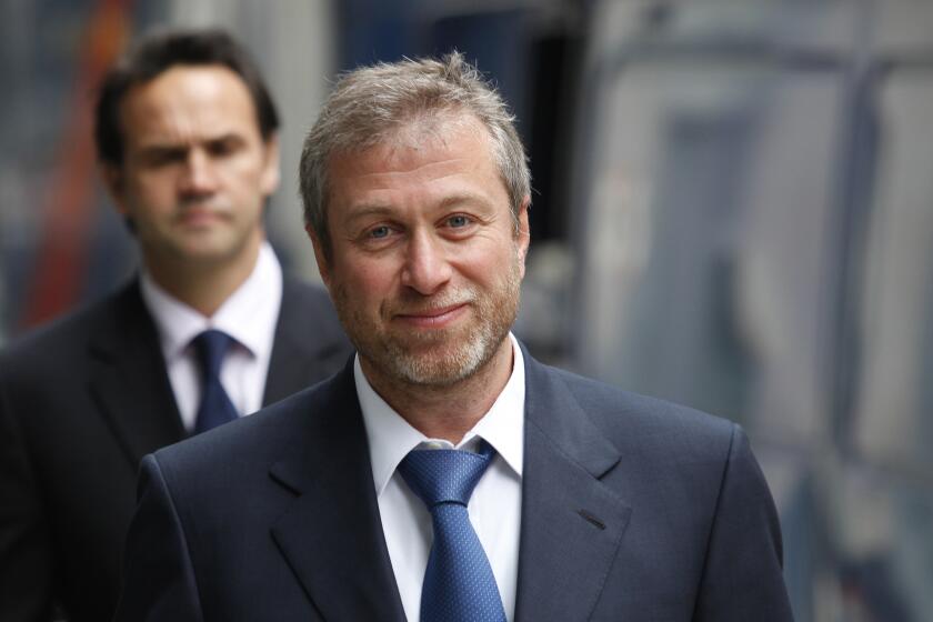FILE - The owner of England's Chelsea Football Club, Russian tycoon Roman Abramovich, as he leaves court in London, Oct. 4, 2011. Soccer club Vitesse Arnhem has been docked 18 points and will be relegated from the Netherlands top division. The club has been under investigation for ties to sanctioned Russian oligarch Roman Abramovich, the former owner of Chelsea. (AP Photo/Lefteris Pitarakis, File)