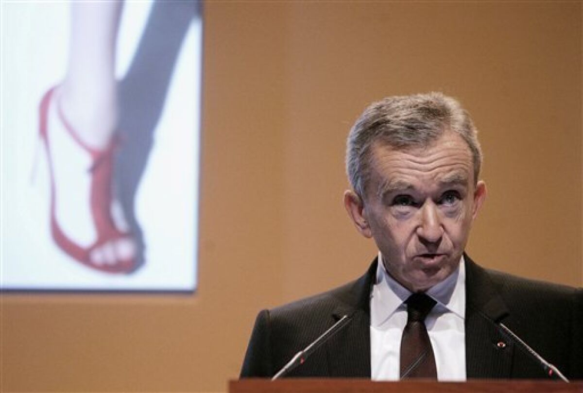 FILE - In this Feb. 5, 2009 file photo, Bernard Arnault, Chairman and CEO of LVMH Moet Hennessy Louis Vuitton, the Paris-based luxury goods empire, presents the group's 2008 results in Paris. The first big blow against the Socialist government’s 75-percent income tax on the richest came last month, when Europe’s richest man and head of luxury retail giant LVMH Moet Hennessy Louis Vuitton, Bernard Arnault, applied for Belgian nationality. He denied it was to avoid taxes, but few were convinced, and the move prompted front-page debate. (AP Photo/Michel Euler, File)
