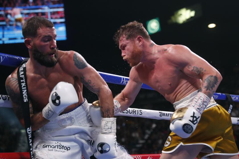 Canelo Alvarez, of Mexico, right, fights Caleb Plant during a super middleweight title unification fight Saturday, Nov. 6, 2021, in Las Vegas. (AP Photo/Steve Marcus)