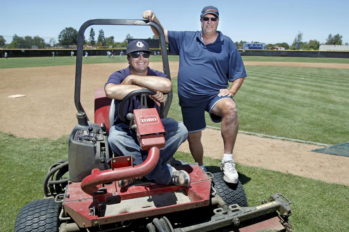 The late Walt Harper, right, and his son Ty, a former Corona del Mar High standout, are shown in a 2012 photo. 