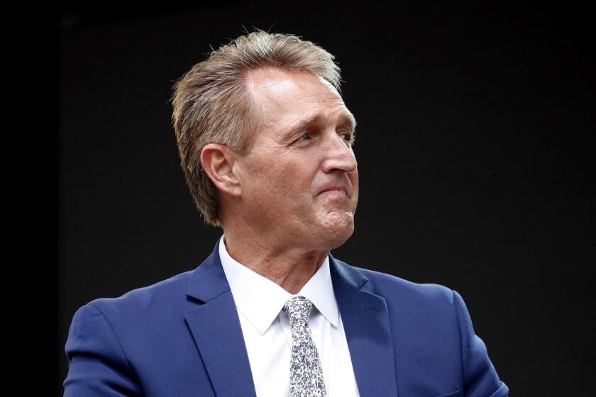 Sen. Jeff Flake, R-Ariz., listens to a question during an appearance at the Forbes 30 Under 30 Summit, Monday, Oct. 1, 2018, in Boston. (AP Photo/Mary Schwalm)