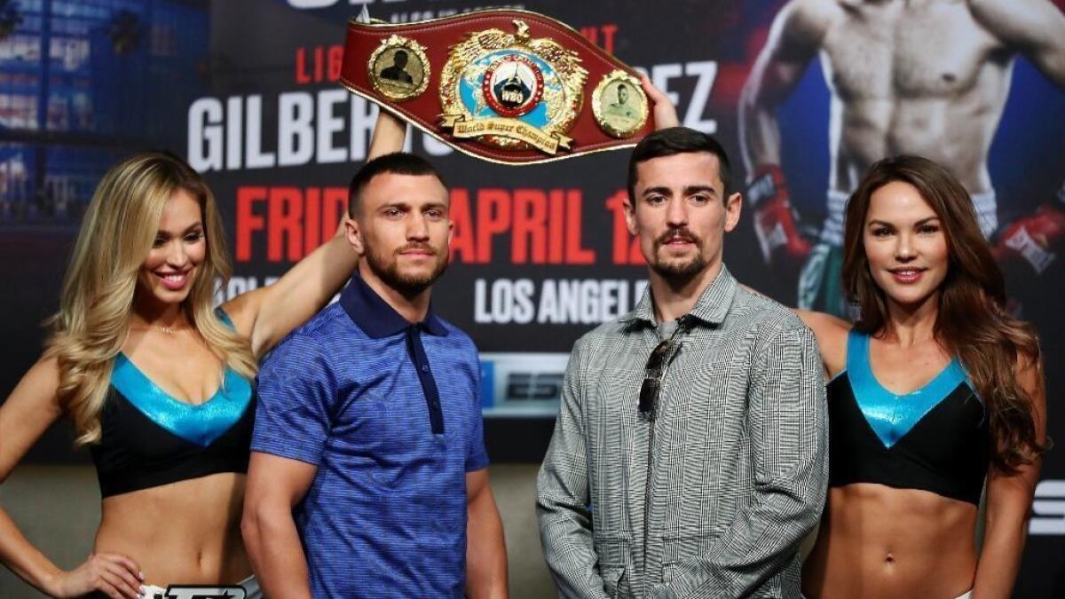 Vasiliy Lomachenko and Anthony Crolla pose for photos after the press conference ahead of their world lightweight championship fight at Staples Center on Wednesday