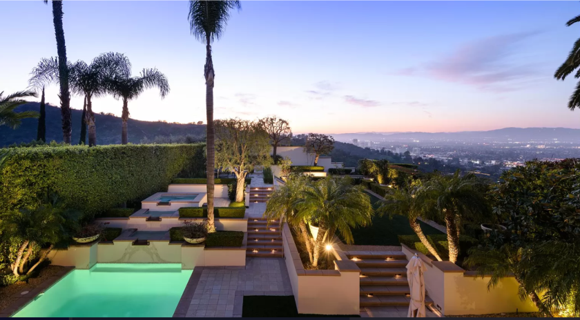 Found in guard-gated Mulholland Estates, the home holds seven bedrooms and 10 bathrooms in 7,500 square feet.