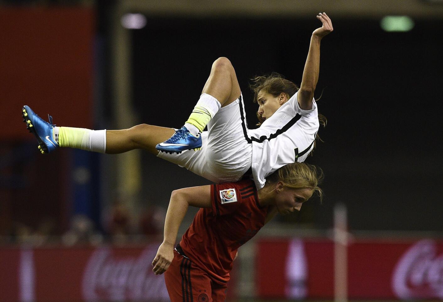USA midfielder Tobin Heath (TOP) vies with Germany's goalkeeper Almuth Schult during the semi-final football match between USA and Germany during their 2015 FIFA Women's World Cup at the Olympic Stadium in Montreal on June 30, 2015. AFP PHOTO / FRANCK FIFEFRANCK FIFE/AFP/Getty Images ** OUTS - ELSENT, FPG - OUTS * NM, PH, VA if sourced by CT, LA or MoD **