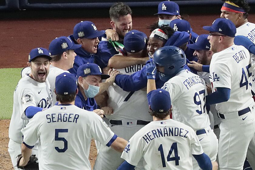 Dodgers celebrate after winning the World Series at Globe Life Field. (Robert Gauthier/ Los Angeles Times)