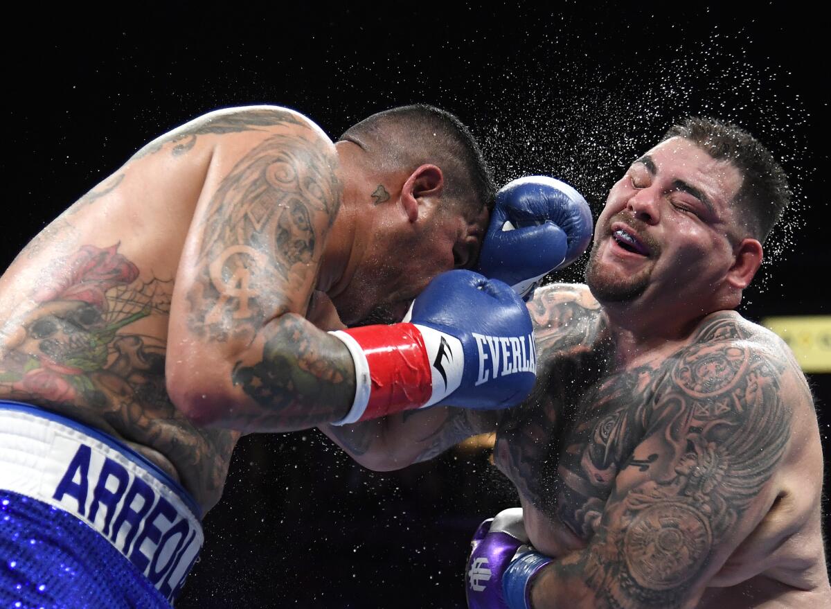 Andy Ruiz Jr. takes a punch from Chris Arreola during their heavyweight fight on Saturday.