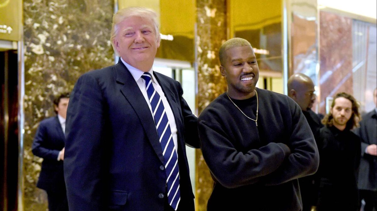 Kanye West and then-president-elect Donald Trump speaking with the press after their meetings at Trump Tower in New York in December 2016.