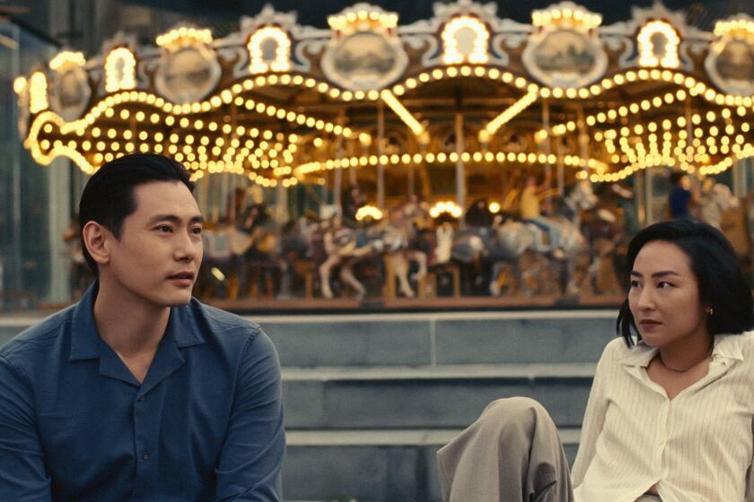 Teo Yoo and Greta Lee in the movie "Past Lives."