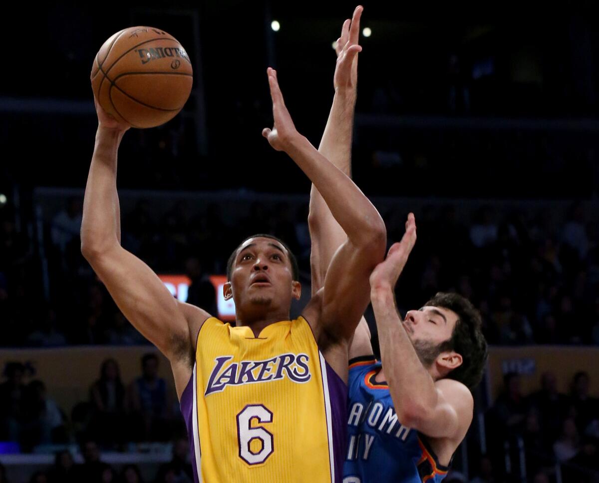 Lakers guard Jordan Clarkson tries to drive to the basket against Thunder guard Alex Abrines in the second quarter on Nov. 22.