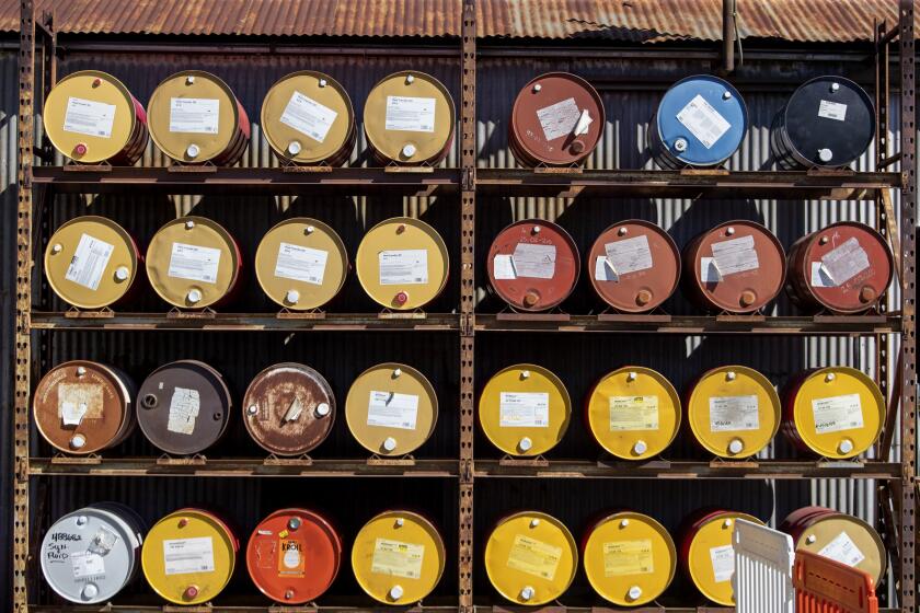 Paramount, CA - February 28: Metal drums of liquids are stored at World Energy Monday, Feb. 28, 2022 in Paramount, CA. (Brian van der Brug / Los Angeles Times)