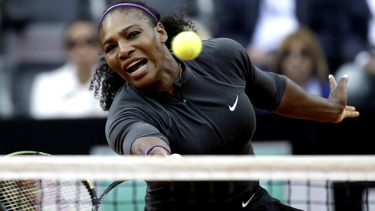 Serena Williams volleys a shot against Irina Begu during their semifinal match at the Italian Open on Saturday