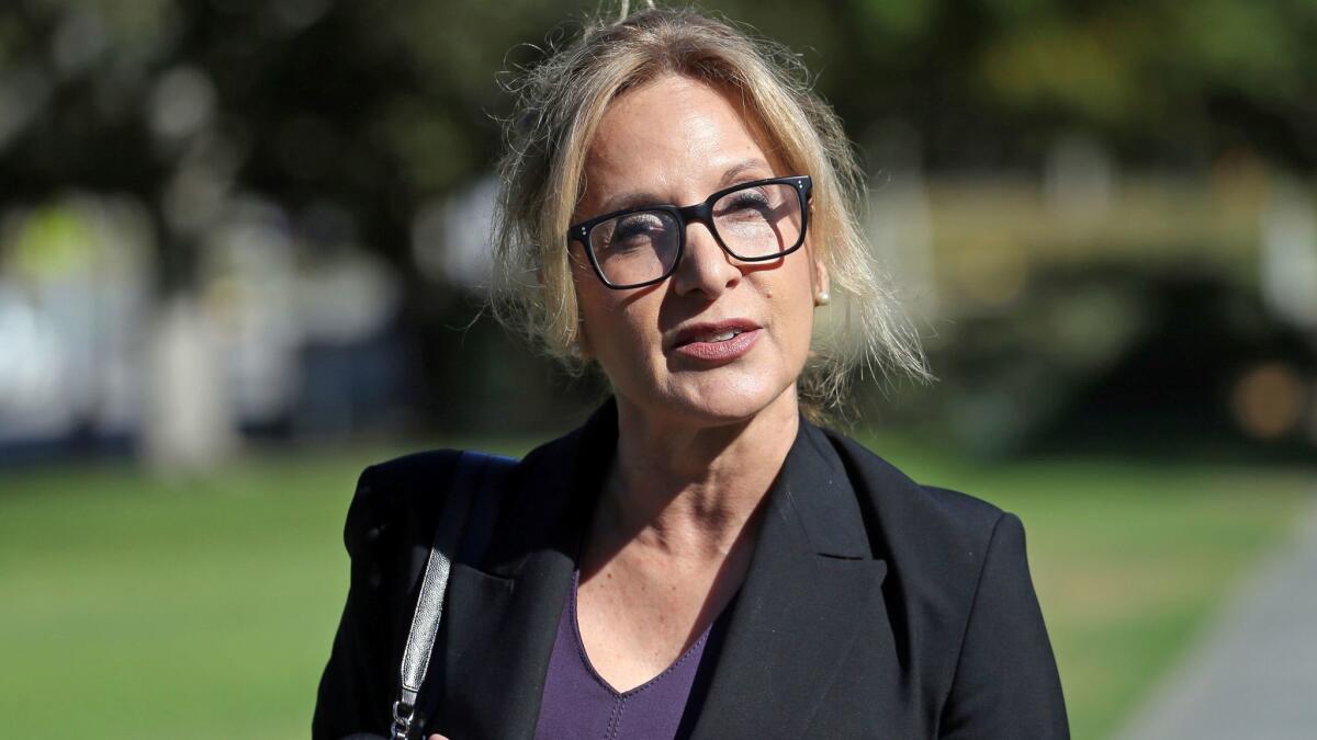 Bill Cosby's attorney Angela Agrusa, seen Tuesday in Santa Monica, says, "He doesn't take lightly these criminal charges. He would never do anything that undermined the importance of this issue."