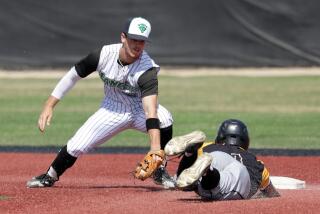 THOUSAND OAKS, CA - MAY 17: Thousand Oaks High School second baseman Roc Riggio tags out Newbury Park's Wesley De La Torre during a game on Monday, May 17, 2021 in Thousand Oaks, CA. (Myung J. Chun / Los Angeles Times)
