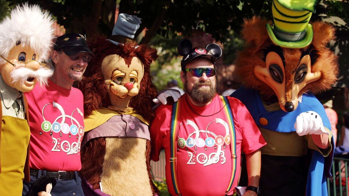 Disneyland Paris’ decision to sponsor the LGBTQ event Magical Pride marks a dramatic shift for the world’s biggest theme park operator. Above, Steve Hoel, left, and James Farless are all smiles during Gay Days at Magic Kingdom in 2003.