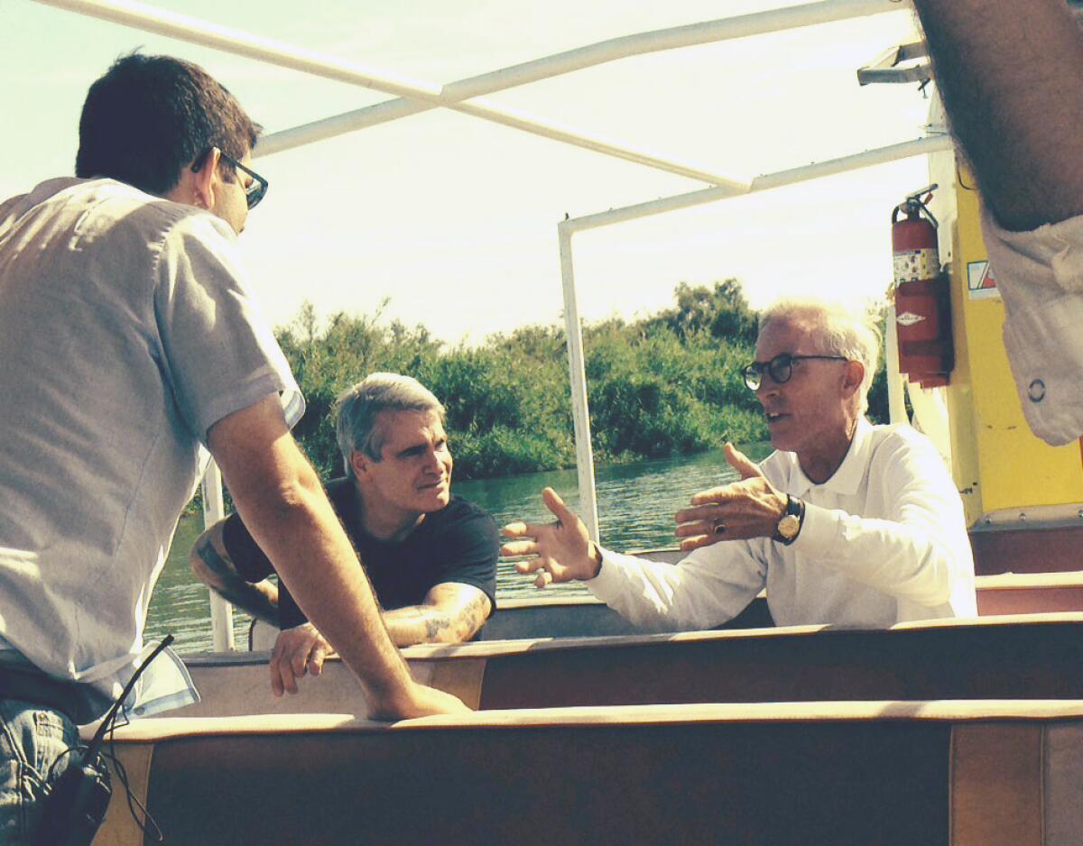 Kevin Kelley, right, is interviewed for a documentary about the Colorado River.