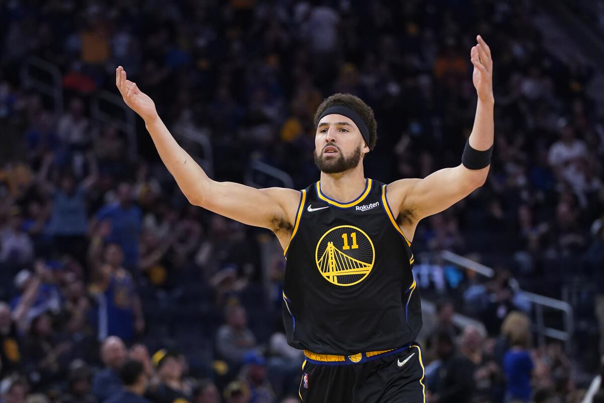 Golden State guard Klay Thompson reacts after making a three-pointer in Game 3 on May 7, 2022.