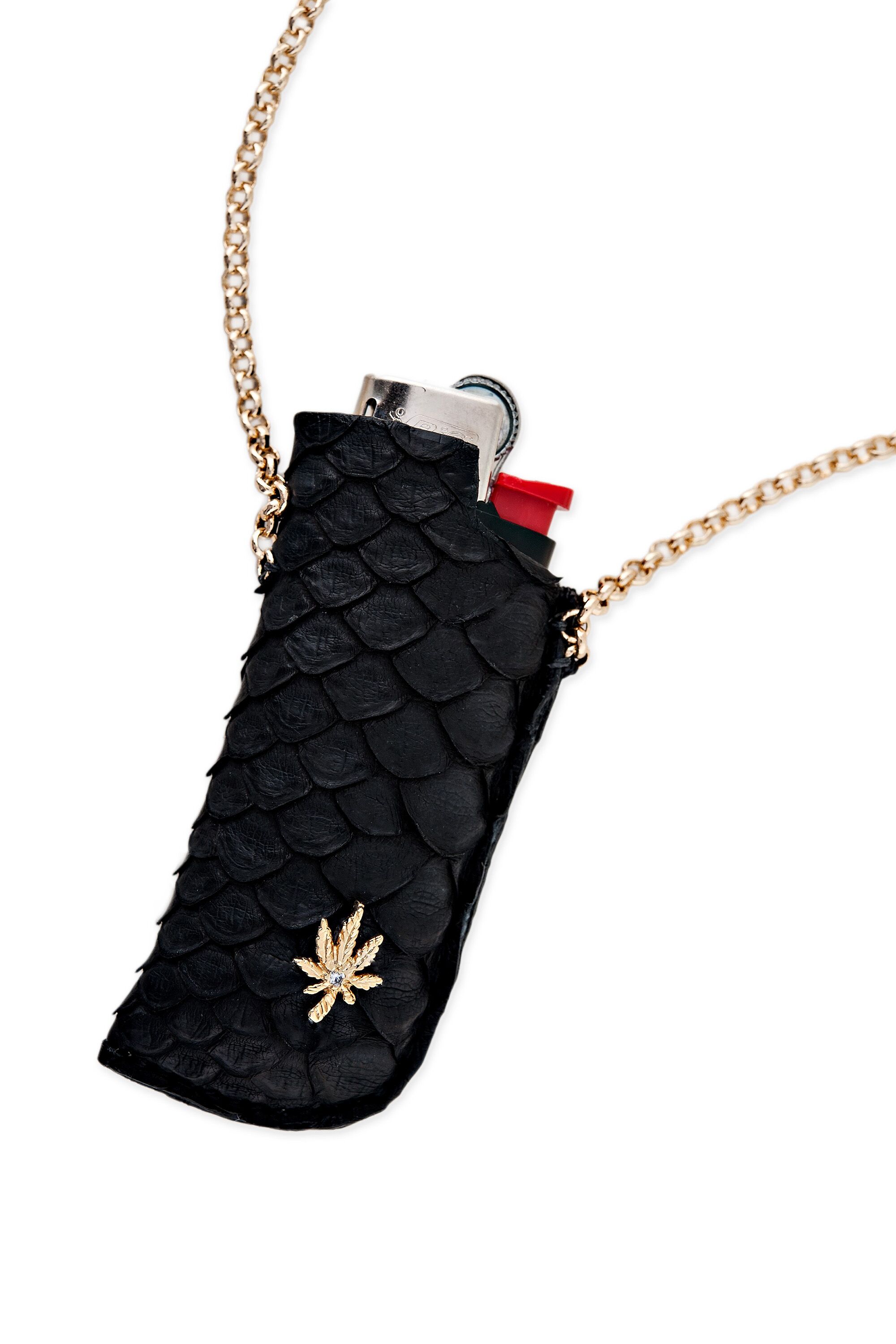 Snake skin lighter necklace from Jacquie Aiche.
