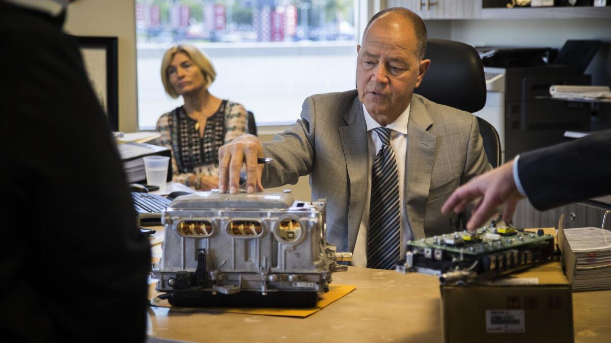 Toyota of Claremont owner Roger Hogan shows a defective power inverter in January 2018.