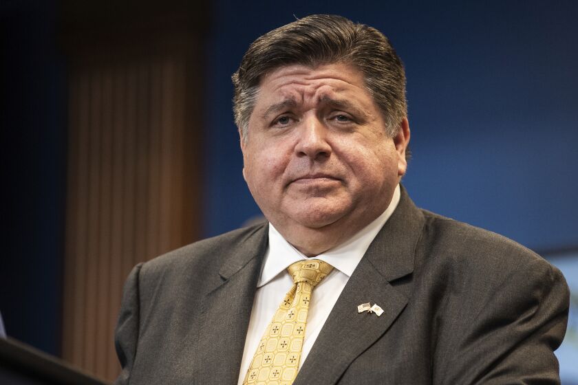 FILE - Gov. J.B. Pritzker reacts during a news conference in the Greektown neighborhood, of Chicago, Wednesday, Sept. 14, 2022. Pritzker warned that his Republican opponent is a far-right politician who would take the state backward while state Sen. Darren Bailey asked voters to consider whether the Democratic incumbent's first term has improved their lives as the two candidates met for an online forum Friday, Sept. 30.(Pat Nabong/Chicago Sun-Times via AP, File)