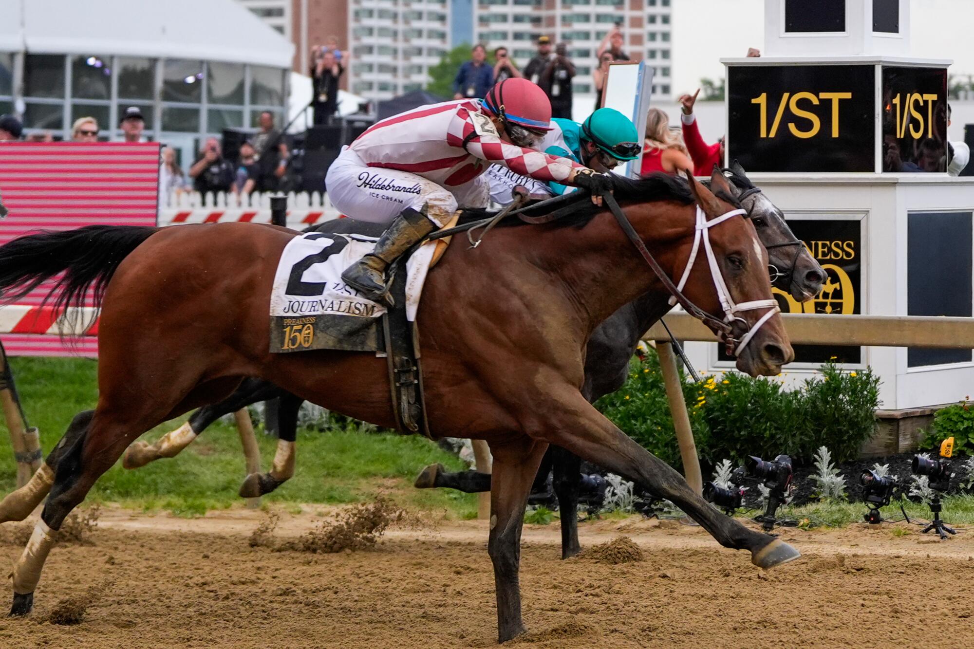 Umberto Rispoli, atop Journalism, left, edges out Luis Saez, atop Gosger, to win.
