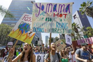 LOS ANGELES, CA - SEPTEMBER 20, 2019 — Evelyn Lamond, 15, left, and Chaya Forman,15, Venice High School students rally in a climate change protest in Pershing Square, Los Angeles on Friday afternoon September 20, 2019 as part of the global climate walkout movement. The global climate strike protests have been inspired by Greta Thunberg, a 16-year-old Swedish activist who sailed across the Atlantic Ocean in a zero-emission yacht rather than fly and on Wednesday met with members of Congress, urging them to heed scientists’ warnings on climate change. (Irfan Khan/Los Angeles Times)