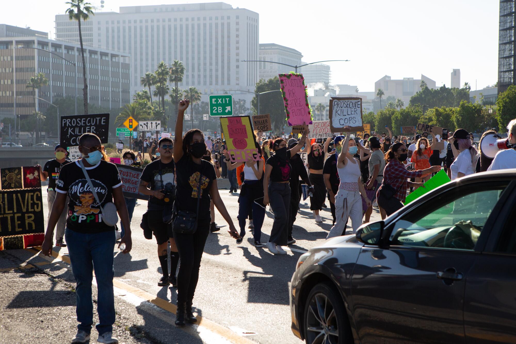 Protesters with Black Lives Matter-LA walk along the 101 Freeway near downtown Los Angeles