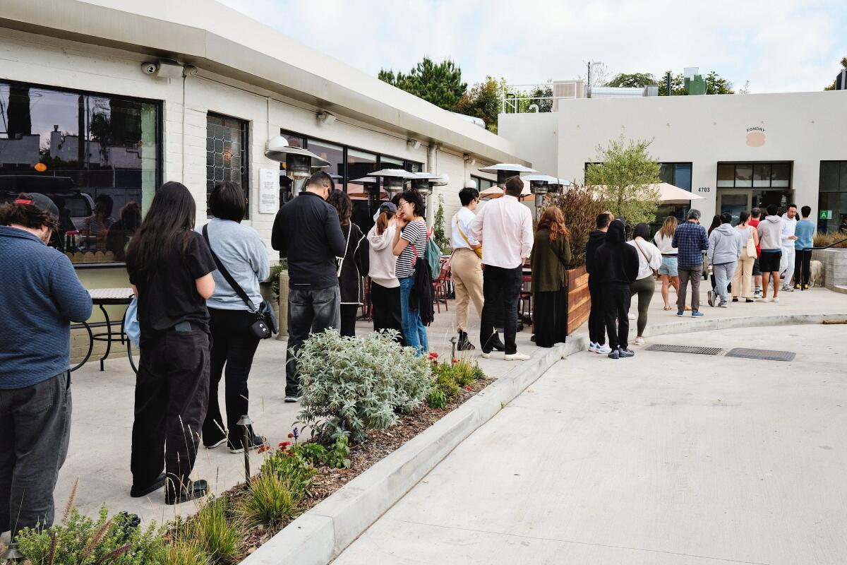 Guests begin lining up for new p?tisserie Fondry, in Eagle Rock, half an hour before doors open.