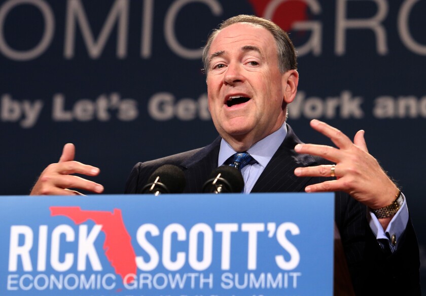 GOP presidential contender Mike Huckabee delivers remarks during Florida Gov. Rick Scott's Economic Growth Summit in Buena Vista, Fla., on Tuesday.