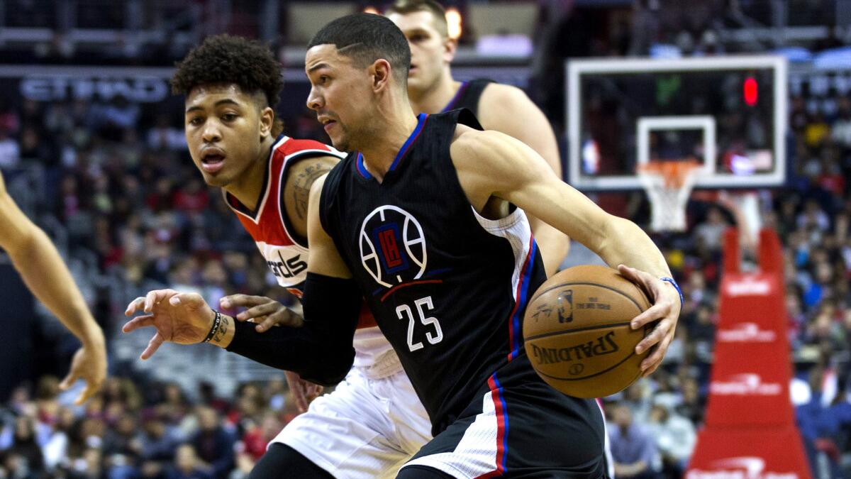 Clippers guard Austin Rivers drives against Wizards forward Kelly Oubre Jr. during a game Dec. 28.