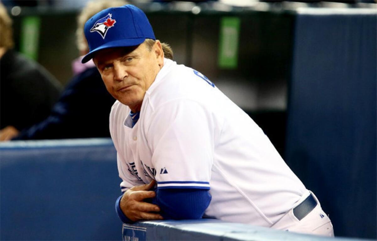Toronto Blue Jays Manager John Gibbons looks down the bench during a game against the Cleveland Indians .