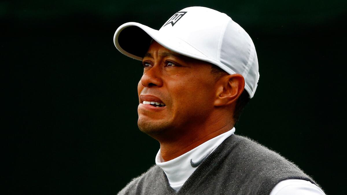 Tiger Woods watches his tee shot from the 17th hole during the second round of the Phoenix Open on Jan. 30, 2015.