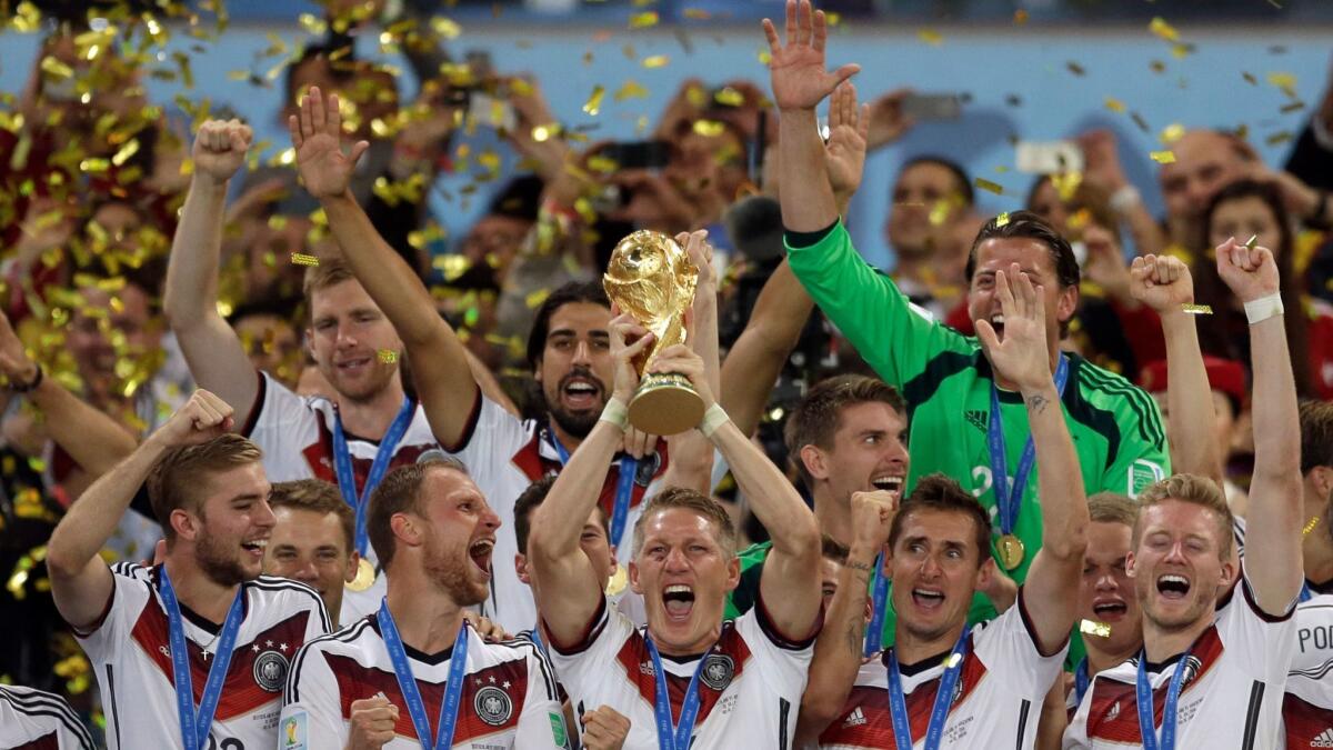 Germany's soccer team celebrates with the World Cup trophy after its 1-0 victory over Argentina after the 2014 final.