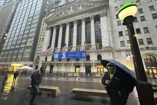 File - Pedestrians pass the New York Stock Exchange as snow falls on Tuesday, Feb. 13, 2024 in New York. (AP Photo/Peter Morgan, File)