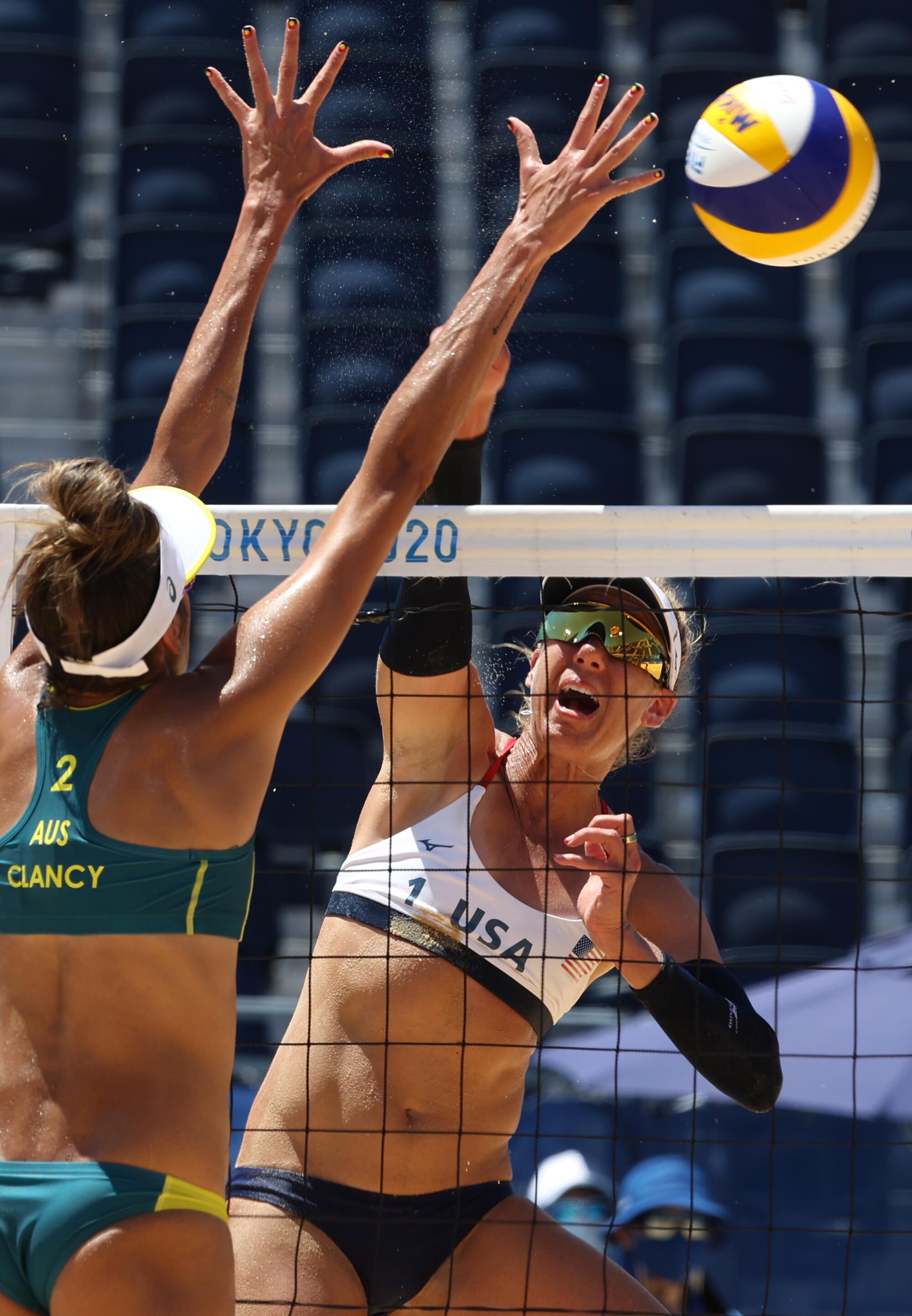 April Ross spikes the ball past Taliqua Clancy of Australia at the Tokyo Olympics