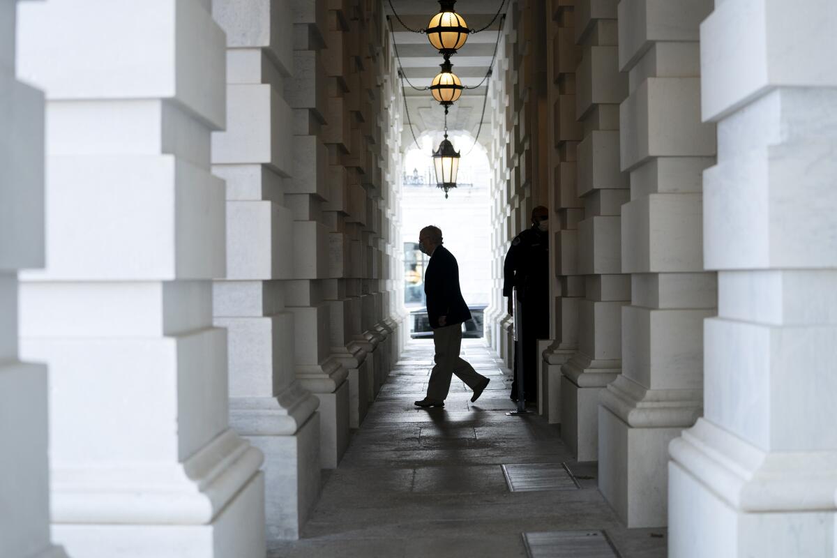 Senate Majority Leader Mitch McConnell's silhouette as he leaves the Capitol.
