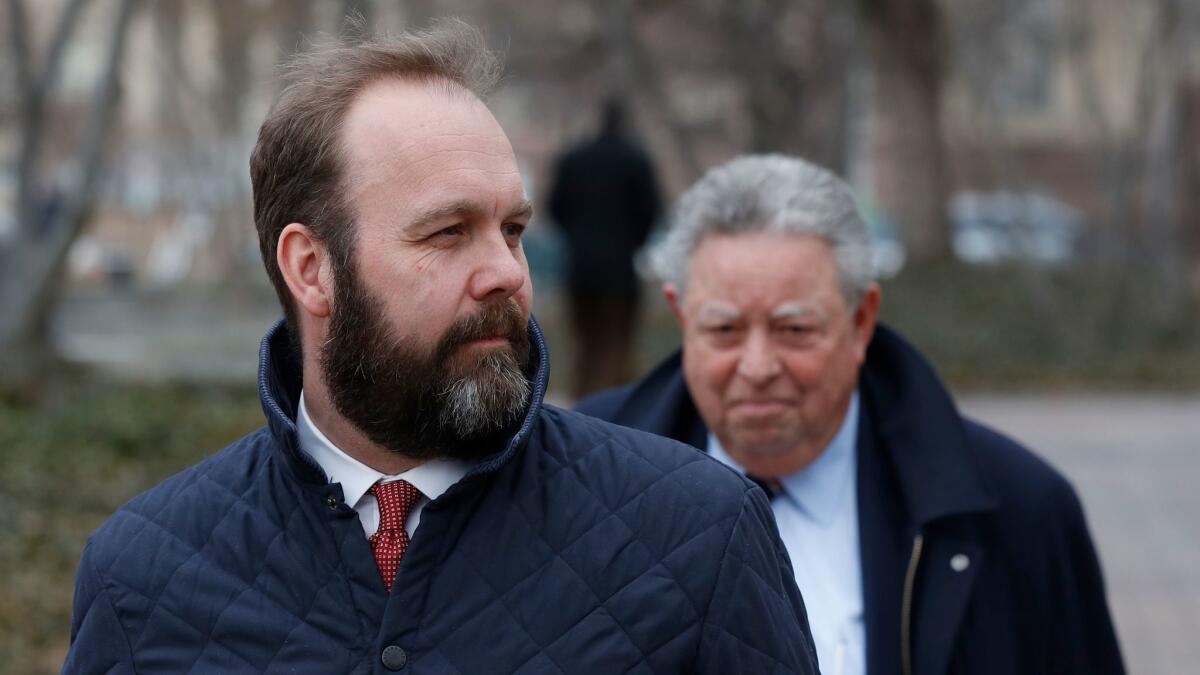 Former Trump aide Richard Gates, left, and his lawyer, Thomas C. Green, leave the federal courthouse in Washington on Feb. 14.