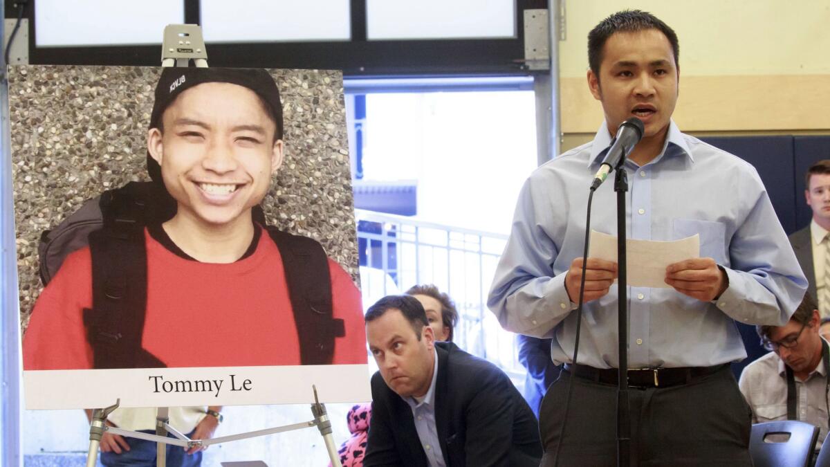 Tommy Le's brother Quoc Nguyen speaks at a community forum in July over Le's death.