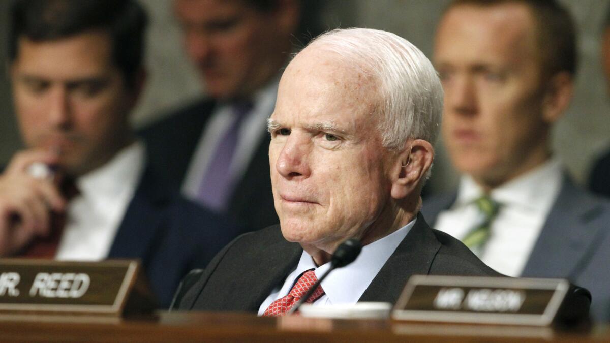 Senate Armed Services Committee Chairman Sen. John McCain (R-Ariz.) listens during a committee hearing on Tuesday.