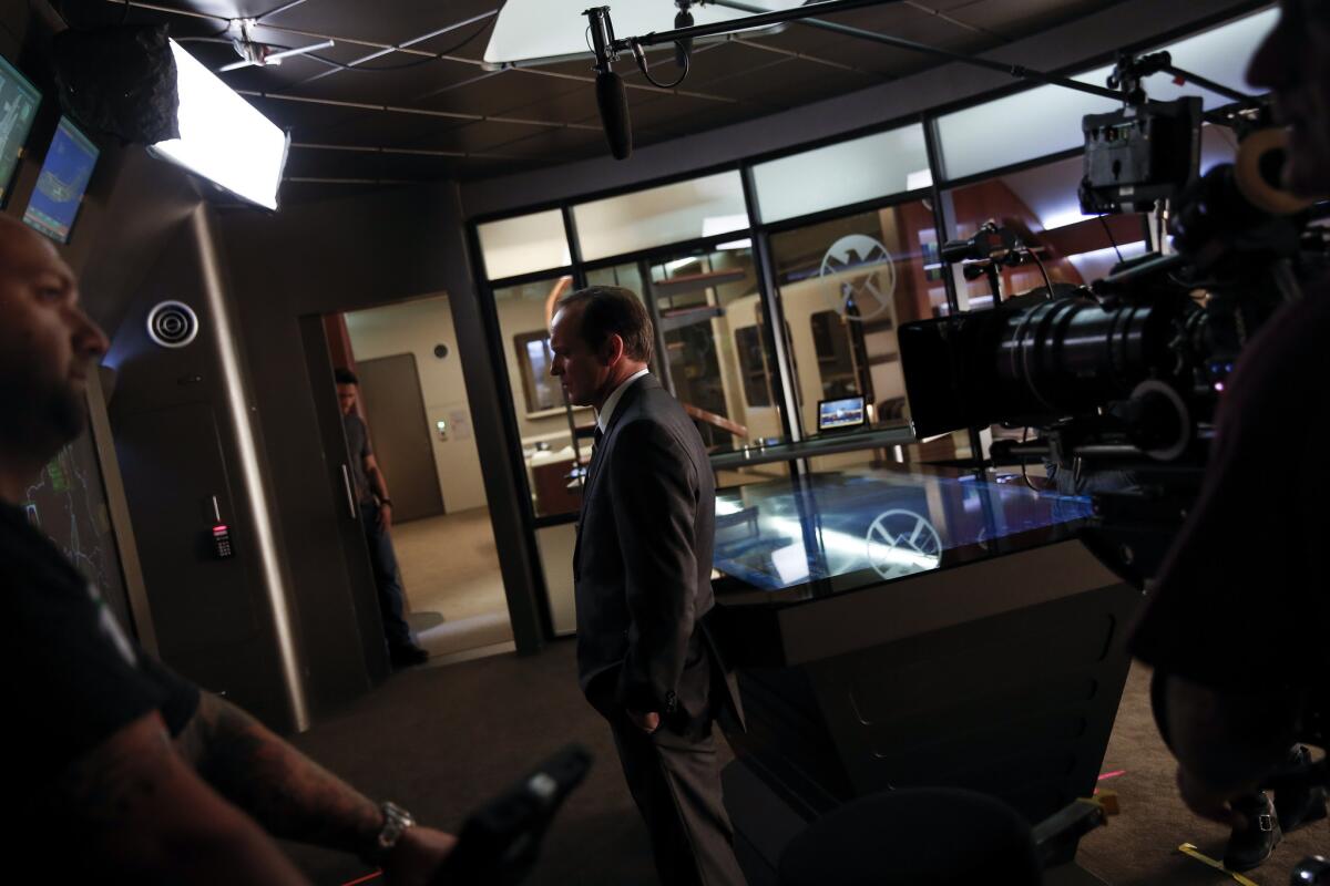 ABC said men made up 54% of the audience for the pilot episode of "Agents of S.H.I.E.L.D." Above, Clark Gregg as agent Phil Coulson films a scene inside the show's command center.