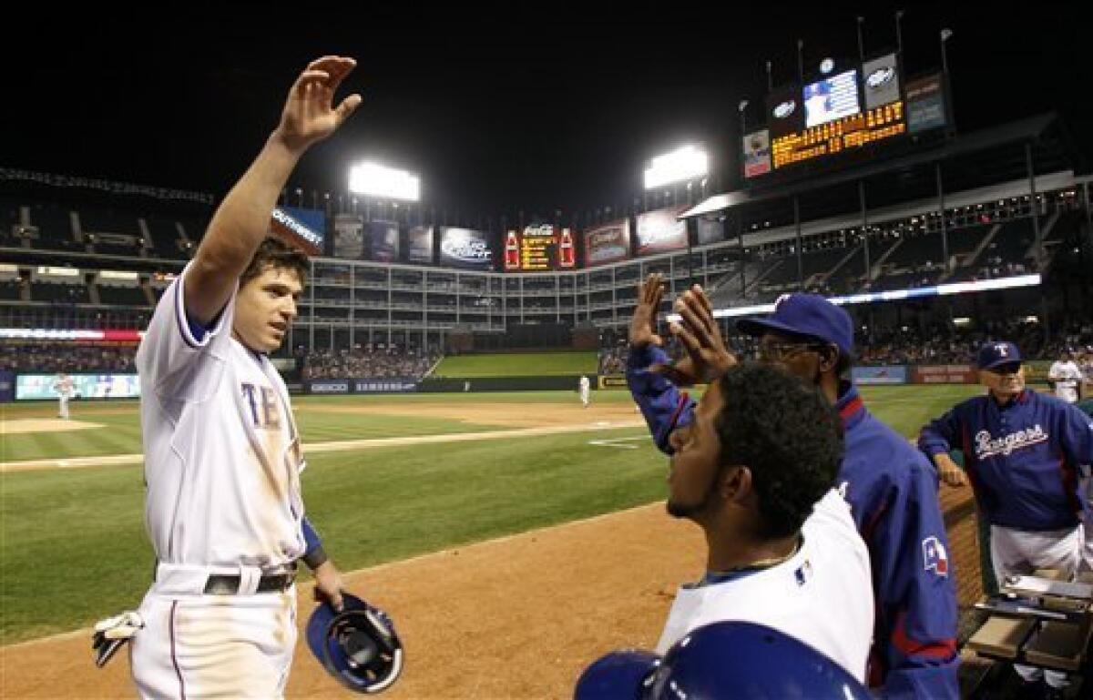 Texas Rangers Ian Kinsler makes the play a ball hit by against the