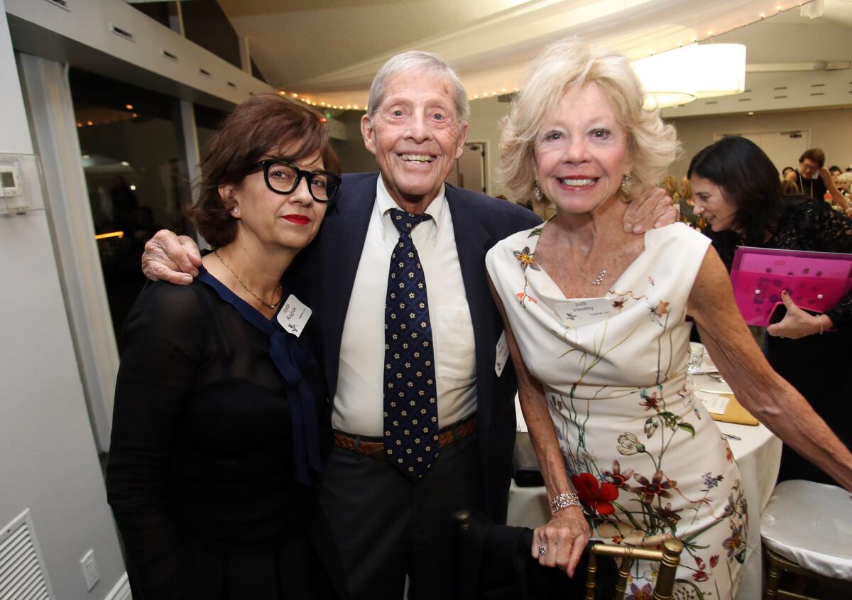 Clemencia Garza, left, Ted Davis and Judi Healey enjoy "An Evening of Wine and Roses" fundraiser for the LCFTRA's entry in the 2020 Rose Parade.