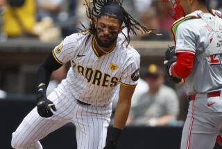 San Diego CA - May: San Diego Padres' Fernando Tatis Jr. flips his hair after an inside pitch against the Cincinnati Reds at Petco Park on Wednesday, May 1, 2024. (K.C. Alfred / The San Diego Union-Tribune)